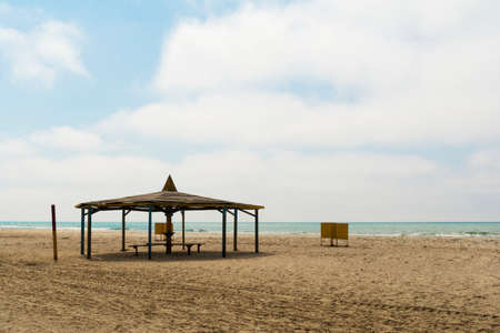 Sunbeds and umbrellas on the beachの写真素材