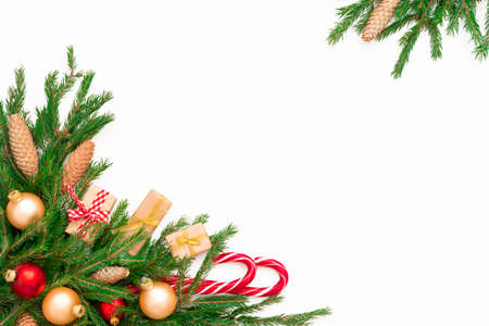 Christmas frame composition with gift box, pine cones, fir tree branches, isolated. Flat lay, top...