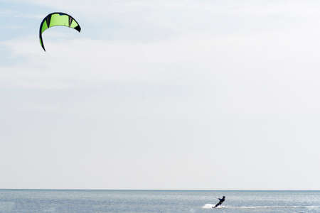 Kitesurfer ride his kite on the Black sea.の写真素材