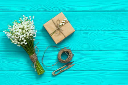 Mockup with bouquet and empty greeting card, gift box top view, copy space for text, flat lay