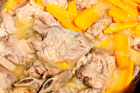 Step two of Cooking tasty pilaf - Zirvak. fried carrots and onion with beef ribs. Cooking pilaf in...