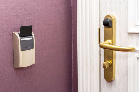 Modern door room with card key in hotel roomの写真素材