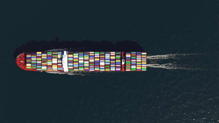 Container ship in the ocean, top view