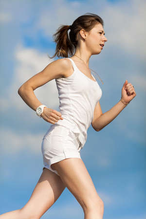 Jogging  Girl running along the beach