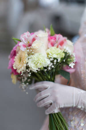 Bridal bouquet  Beautiful bouquet in hand of brideの写真素材