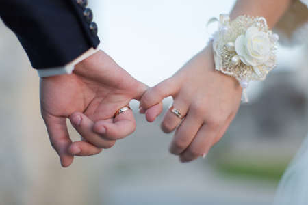 Wedding hands  Man and woman making a pinkie promiseの写真素材