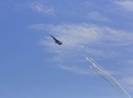 War jet plane in sky  Russian jet fighter launches anti-missile flares during Day of Russian Navy in Sevastopol  Crimea の写真素材