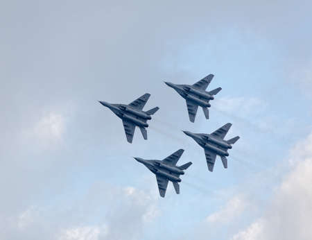 Four war jet planes in sky. Russian military jet planes showing aerobatics