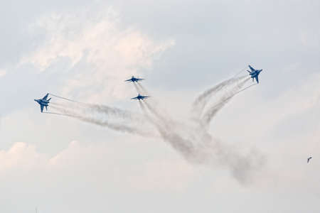 Four war jet planes in sky. Russian military jet planes showing aerobatics