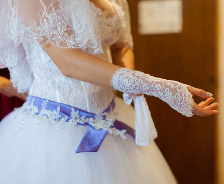 Bride puts on a white gloveの写真素材