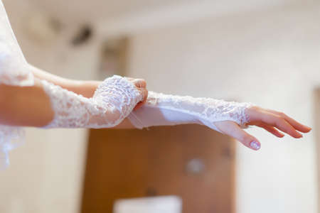Bride puts on a white gloveの写真素材