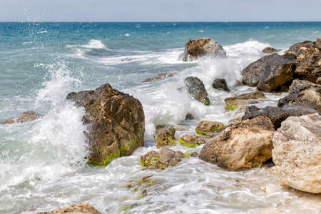 Rocky shore of the sea during the surf. Seascape with surfの写真素材