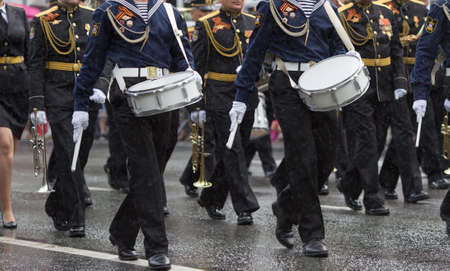 Drummers in a Marching Band. Navy orchestra participate in parade.のeditorial素材