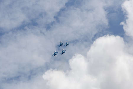 Four war jet planes in sky. Russian military jet planes showing aerobatics in time of military...