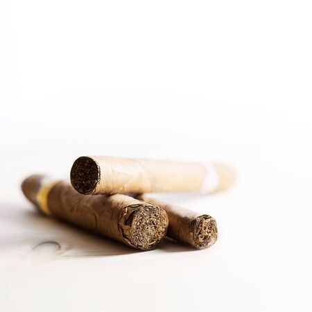 three cigars on white backgroundの写真素材