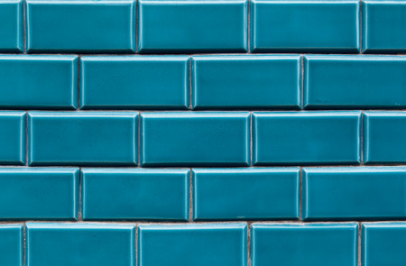 Blue ceramic brick tile wall,background tiles on facadeの写真素材