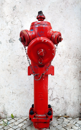 Closeup to a red fire hydrant on a street