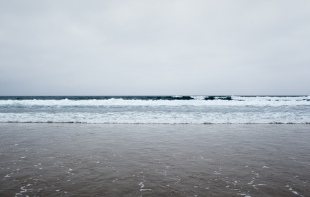 sea and cloudy sky waves in Atlantic Ocean minimal backgroundの写真素材