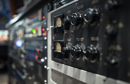 Professional audio sound equipment with buttons and sliders . Selective focus.の写真素材