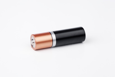 One AA battery on white  backgroundの写真素材