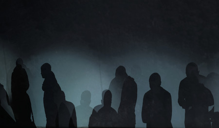 photography of abstract silhouette mysterious people in a dark background