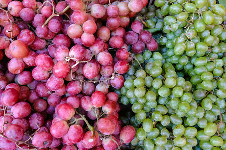 red wine grapes background, white grapes,background in a local market bunch of grapes ready to eatの写真素材