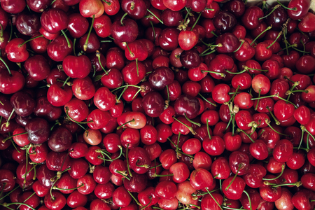 Close Up of pile of ripe cherries top viewの写真素材