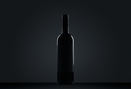 Bottle of red wine on black backgroundの写真素材