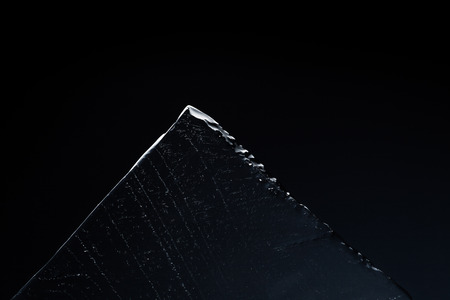 triangle piece of ice on black background texture, structure of ice, Ice and icebergs conceptの写真素材