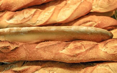 many fresh baguettes background