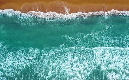 aerial view of sea waves on sand beach, pacific ocean