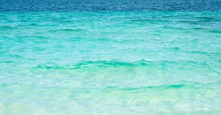 Tropical sea waves blue water in daylight ocean surfaceの写真素材
