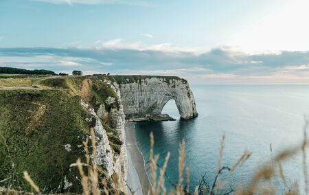 cliffs of Etretat with coastline at sunset,Normandy,France,Europeの写真素材