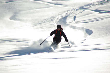 SILLIAN,AT - CIRCA MARCH 2011 - Skier leaves a track in deep snow circa March 2011 at Sillian,AT.のeditorial素材