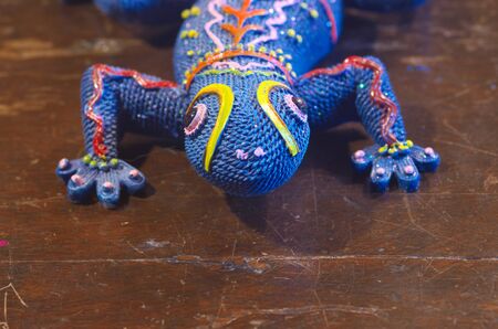 Handcrafted blue gecko statue, copyspace down.の写真素材