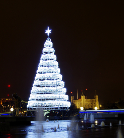 LONDON,UK - 01 DEC 2016 - Christmas tree and the Tower of Londonのeditorial素材
