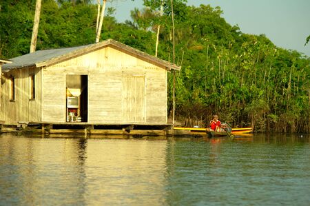 MANAUS, BR - CIRCA AUGUST 2011 - Stilt house on the Amazon river bank