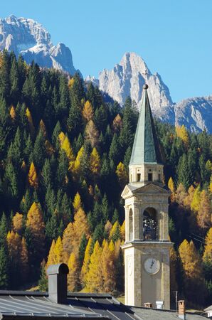 Autumn colours in Comelico, the church of Padola and Mt. Popera