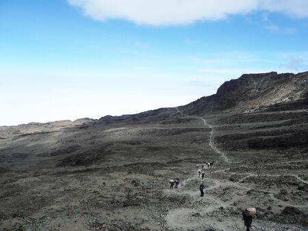 MOSHI,TZ - CIRCA AUGUST,2010 - Local guide shows the trail to Barafu camp, the last before the summit of Kilimanjaroのeditorial素材