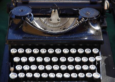 Vintage antique black typewriter with round alphabet buttonsのeditorial素材