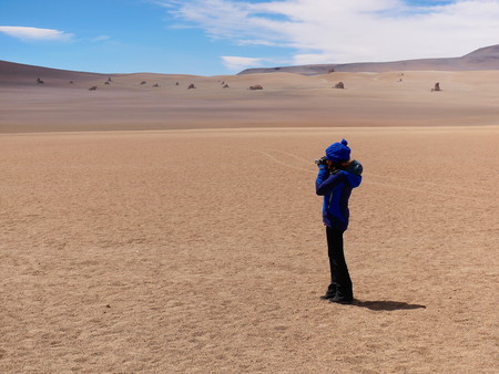 Desert of Bolivia looks like paintings by Salvador DalÃ¬. Andean altiplano of Bolivia, South America. Young tourist standingの写真素材