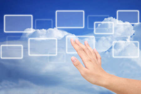 button on a man hand background blue skyの写真素材