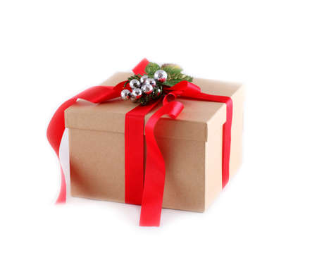 Brown paper gift box with red ribbon bow, isolated on whiteの写真素材