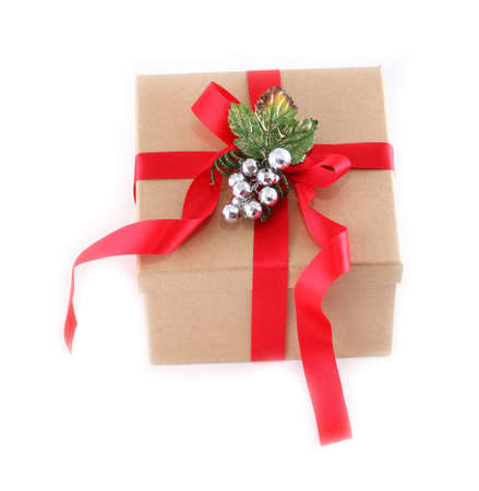 Brown paper gift box with red ribbon bow, isolated on whiteの写真素材