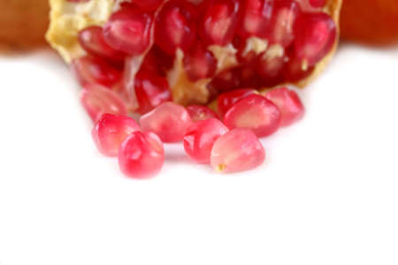 Pomegranate seed pile isolated on white backgroundの写真素材
