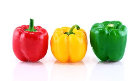 Green, red, yellow pepper is isolated on a white background の写真素材