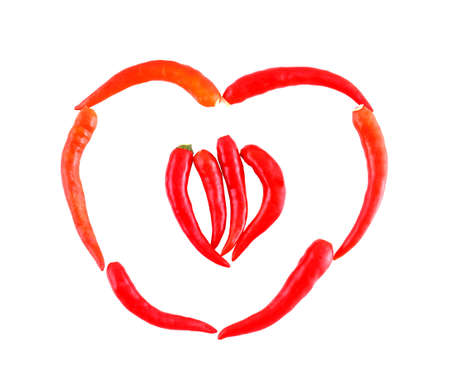 Red chili pepper heart shape isolated の写真素材
