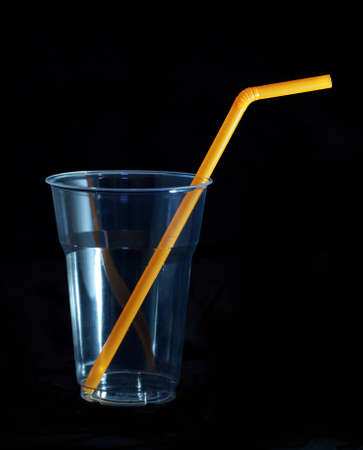 Drinking straw refracted on black backgrounの写真素材