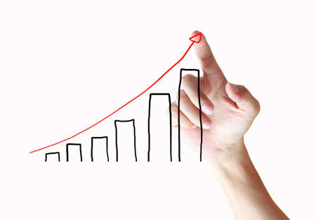 Male hand drawing a graph の写真素材