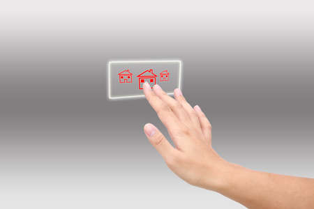 button houses on a man handの写真素材